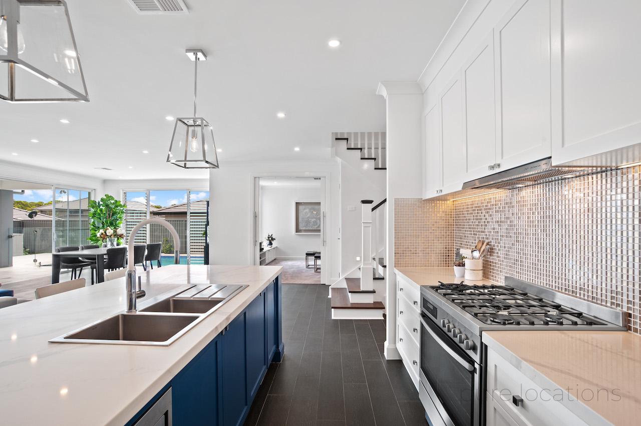 Hamptons inspired kitchen with blue timber cabinetry available for photoshoot hire 
