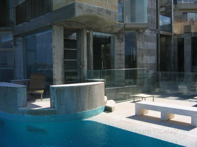 A pool and the house exterior of a location house for TVC filming 