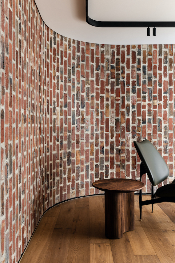 Beautiful brick wall with table and chair in Melbourne