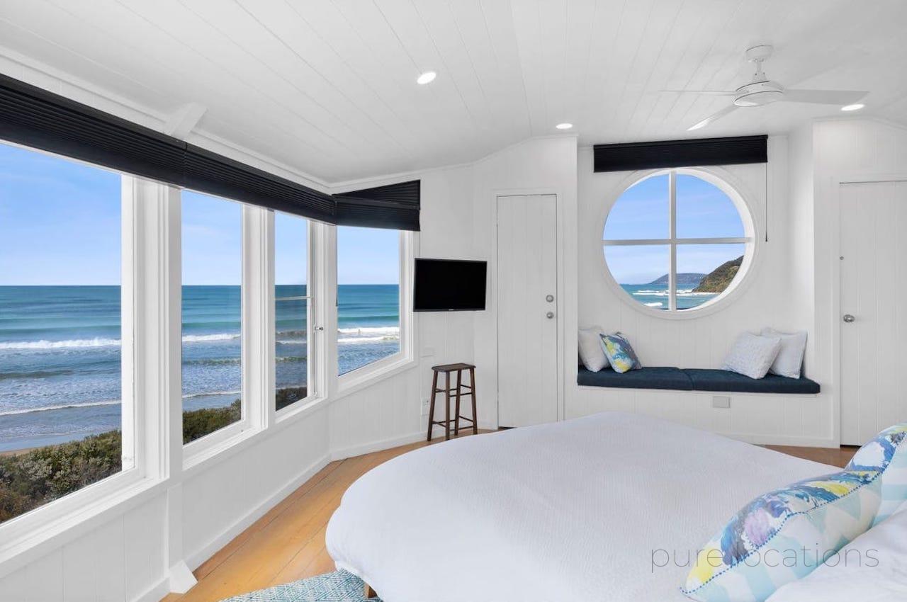 Port window, Bedroom with ocean views, coastal bedroom design