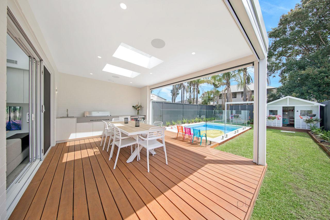 Family friendly backyard with decking, BBQ, pool and cubby house for photoshoots