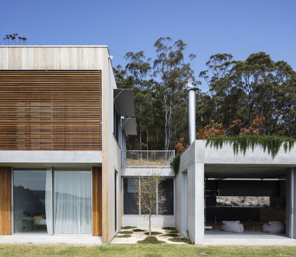 The exterior of a modern industrial concrete location house on the Central Coast