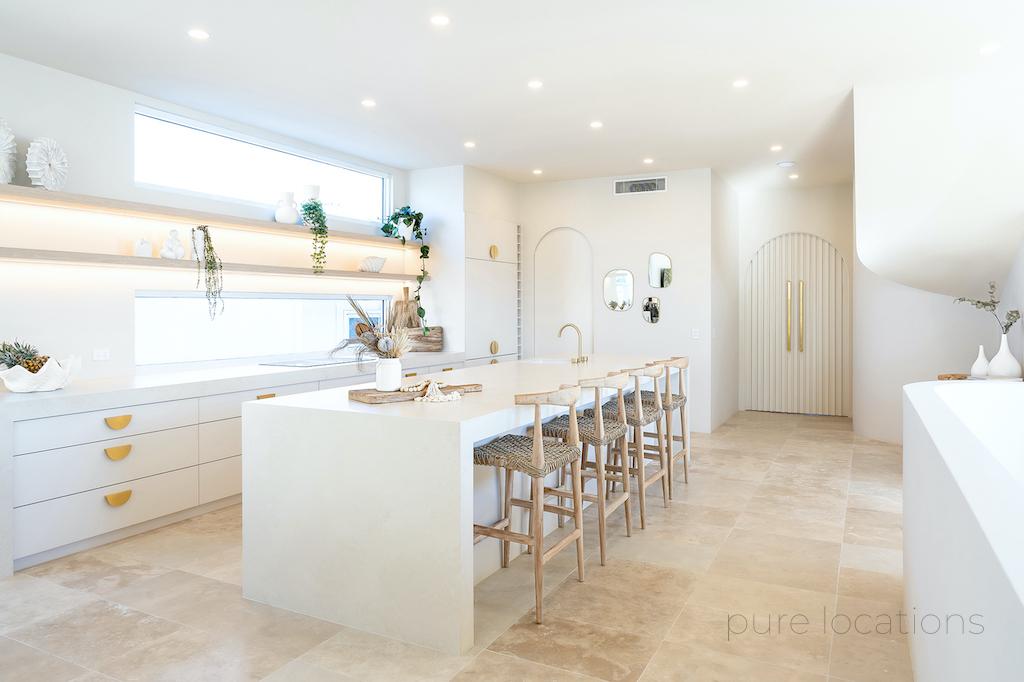 White kitchen with brass accents, Terrazzo floor with square set walls