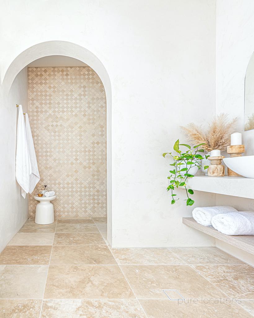 Bathroom with terrazzo tile and stone, arches in bathroom