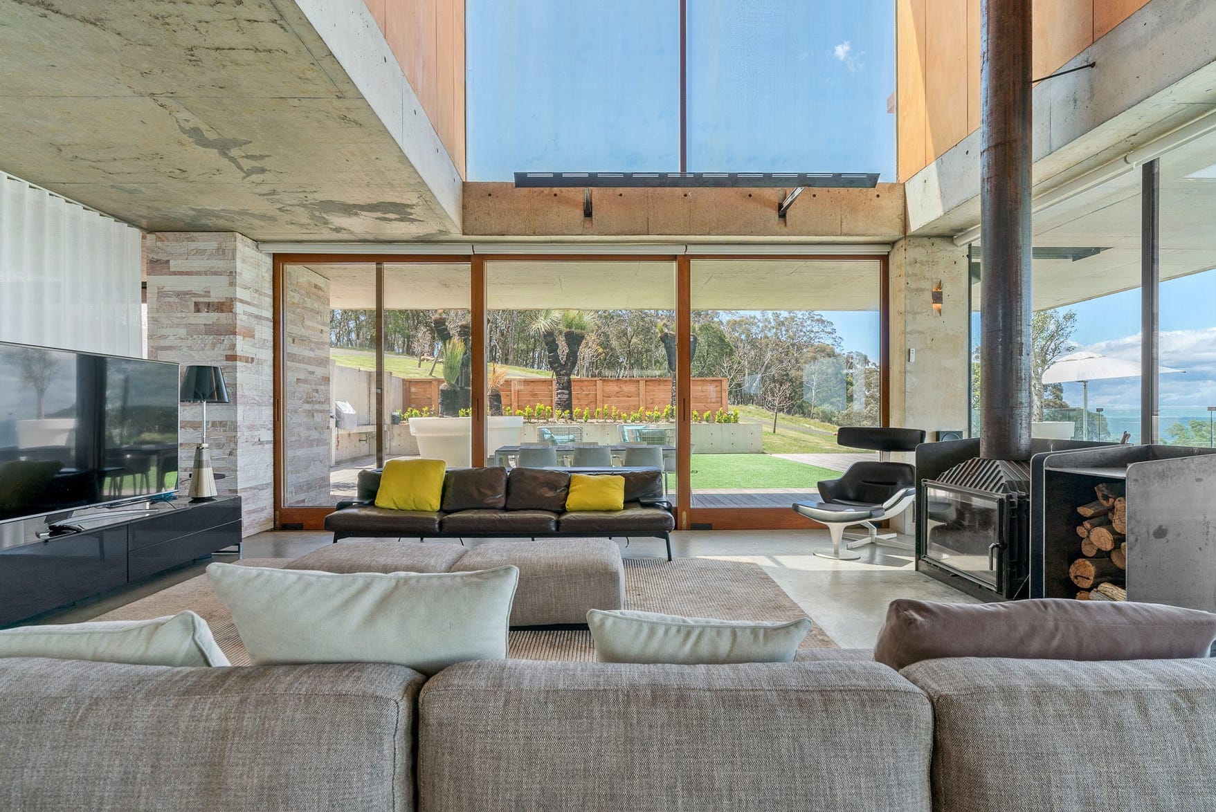 Concrete construction, floor to ceiling glass windows