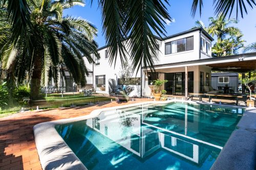 facade garage driveway pool backyard
