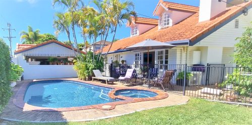 outdoor area facade pool garage driveway garden established backyard