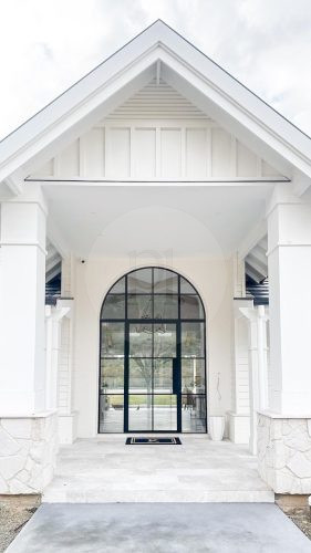 facade garage driveway outdoor area pool backyard garden established