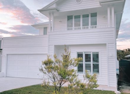 garage facade driveway garden established